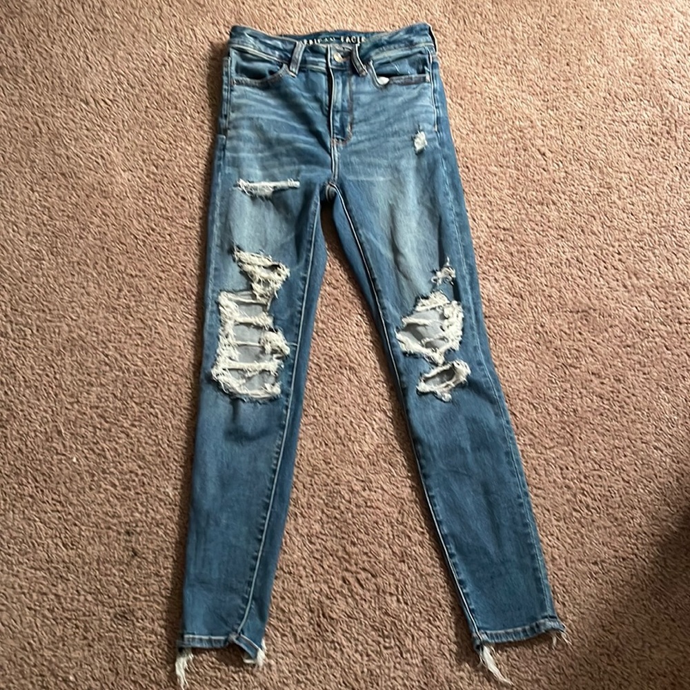 american eagle ripped blue jeans
